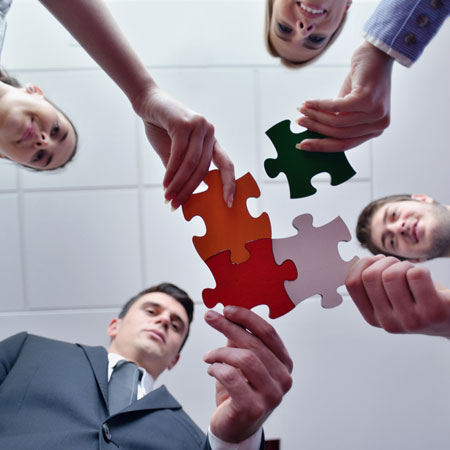 Business putting jigsaw puzzle together